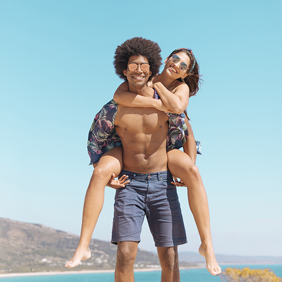 laughing girl sitting back guy looking camera